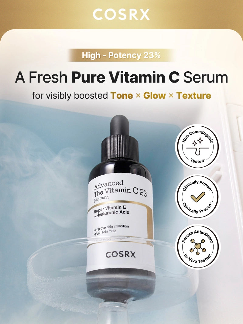 COSRX Advanced The Vitamin C 23 Serum displayed on an icy blue background with clinical proof badges for non-comedogenic, antioxidant, and clinically proven results; formulated with 23% pure Vitamin C to visibly improve tone, glow, and texture while reducing dark spots and refining pores.