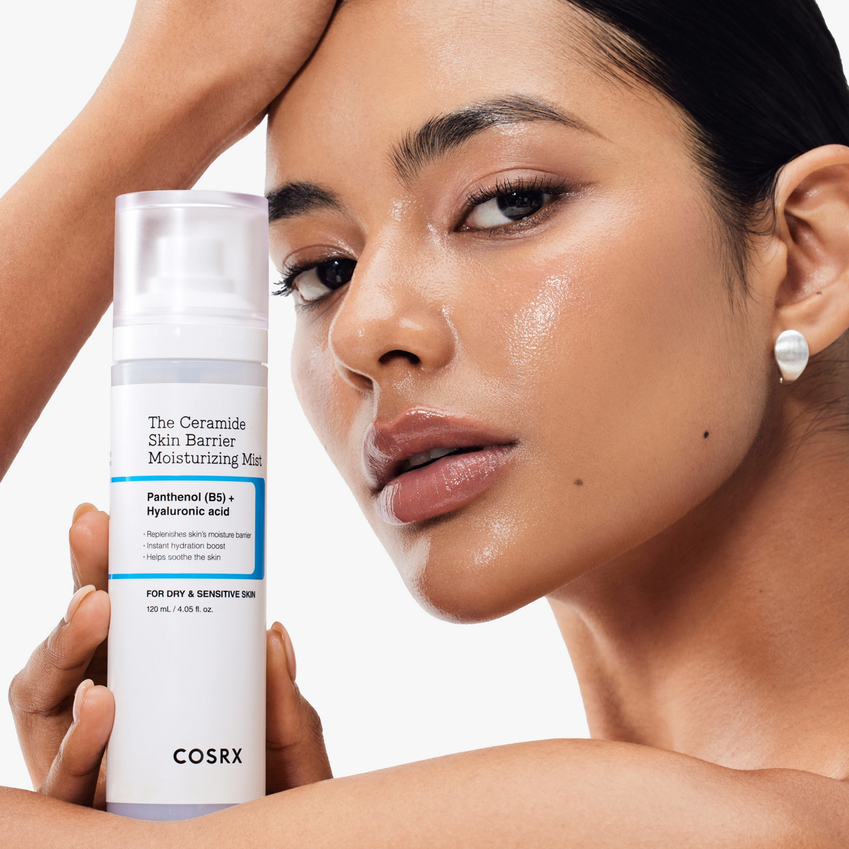 Model with radiant, dewy skin holding COSRX The Ceramide Skin Barrier Moisturizing Mist; showcases the product’s ceramide-rich formula that delivers instant glow, deep hydration, and barrier reinforcement for dry and sensitive skin, clinically shown to increase surface barrier moisture by 77.8% for lasting smoothness and comfort.